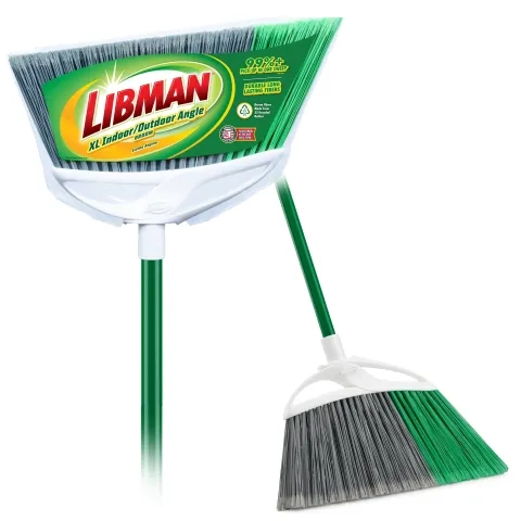 Broom in plastic packaging next to broom out of packaging