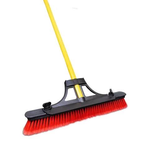 Push broom with red fibers and yellow handle